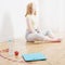 girl doing sports at home, electronic scales on the floor