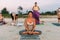 Girl doing yoga at the beach, at sunset time. Time for yoga. Attractive and-healthy young-woman doing exercises on the beach at su