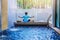 Girl doing yoga fitness exercise for relax and meditation at poolside Inside in the house,during meditation with a orange juice