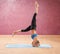 Girl doing yoga standing on head upside down