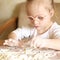 Girl with Down syndrome playing flour