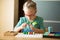 Girl with Down syndrome puts on fingers numicon pegs