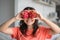 Girl and dragon fruit. Joyful girl enjoying tropical fruits