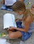 Girl draw a sea on asphalt