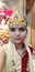 A girl dress as Hindu god krishna.