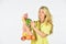 Girl in dress carry bag shopper. Woman holding string shopping bag with fruits. Reusable bag. Grocery store. Bag with