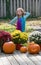 Girl dressed as a hippie flower child, strikes a pose