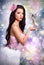 Girl dressed as a princess fairy holds in his hands. fantastic brunette doll on a colorful background,