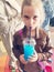 Girl drinking blue cold drink
