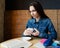 Girl drinking green tea in a cafe