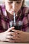 Girl Drinking Sugary Fizzy Soda From Glass With Straw