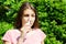 Girl drips blocked nose from allergy. Woman with Respiratory Spray for nose in Spring Blooming. Portrait of a woman having