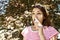Girl drips blocked nose from allergy. Woman with Respiratory Spray for nose in Spring Blooming. Portrait of a woman having respira