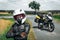 Girl driver portrait, protective equipment, turtle. body armor jacket. Adventure motorbike with side bags. a motorcycle tour