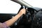 Girl drives a car, holds the steering wheel with one hand, isolated white background