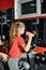 A girl with dumbbells is engaged in a gym, a woman trainer helps with exercises