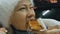 Girl eat pizza cheese four. Close up of young woman mouth greedily eating pizza and chewing in outdoor restaurant. Junk