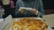 Girl eat pizza cheese four. Close up of young woman mouth greedily eating pizza and chewing in outdoor restaurant. Junk