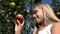 Girl Eating Apple, Kid in Orchard, Kid Tasting Fruits in Tree, Farmer Blonde Child at Village at Countryside