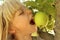 Girl Eating Apple in Tree