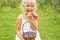 Girl eating delicious and healthy blueberries