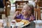 Girl eating French fries.