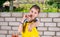 Girl Eating Fresh Peppers and Giving Thumbs Up