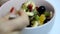 girl eating fruit salad. Diet, healthy fruit salad in the white bowl - healthy breakfast, weight loss concept