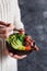 Girl eating hawaiian tuna poke salad in the bowl