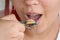 Girl eating oysters, snails in a restaurant, eating seafood, close-up