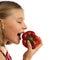 Girl eating a red pepper