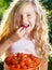 Girl eating strawberry