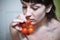 Girl eating tomato