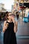 Girl eating two ice creams on the street