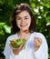 Girl eating vegetable salad