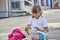 A girl eats a homemade sandwich in the schoolyard. Nutrition for children during their studies. Healthy lunch or snack