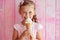 Girl Eats Vanilla Ice Cream On Pastel Background