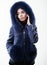 Girl elegant lady wear fashionable coat jacket with furry hood. Luxurious fur. Girl posing hooded fur coat. Female with