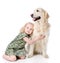 Girl embraces a Golden Retriever.