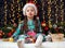 Girl with emotion in christmas decoration with gift, dark background with illumination and boke lights, winter holiday concept