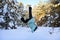 girl is engaged in outdoor sports in early winter morning. Teenage girl does handstand in the snow. Concept of sports