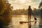 Girl engages in stand-up paddleboarding on a serene varnish