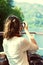 Girl enjoying boat ride, taking photographs