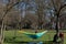 Girl enjoying the first sun and vitiamin D in a hammock in Maastricht