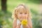 Girl enjoying floral aroma. Child enjoy life without allergy