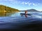 A girl enjoying kayaking on the beautiful and calm ocean waters of Howe Sound, off of Gambier Island, British Columbia, Canada.