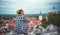 Girl is enjoying nice city scenery. Overlooking beautiful Mikulov castle, Chateau  from Saint Hill while sunset. Wine region. Sout