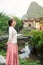 Girl enjoying by the river in scenic karst area