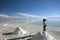 Girl enjoying the view of the salt flats of Salar the Uyuni in Bolivia