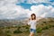 A girl enjoys a beautiful landscape with mountain views on the island of Rhodes